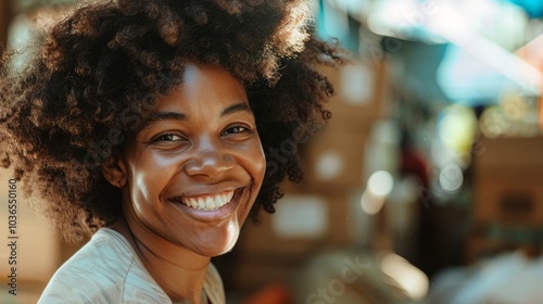 Grateful Afro woman volunteering at a local shelter with joy.