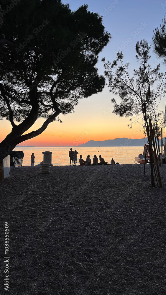 Sunset on the beach, people watching the sunset on the Adriatic Sea in Croatia. Silhouette photography Sunset on the beach, people watching the sunset on the Adriatic Sea in Croatia. Silhouette photography