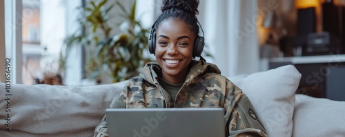 Obraz na płótnie Cheerful female soldier video calling her family on a laptop, Generative AI w salonie