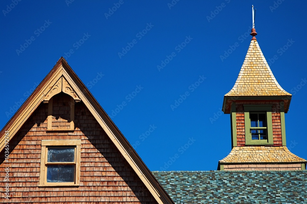 Layered rooftops form a captivating mosaic of textures and hues beneath a bright azure sky, highlighting the charm of classic design. Layered rooftops form a captivating mosaic of textures and hues beneath a bright azure sky, highlighting the charm of classic design.
