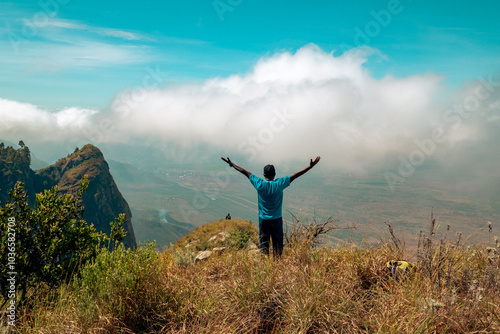 Scenic view of a hiker at a scenic lookout at Kwa mkeka Peak on the Usambara Mountains in Lushoto, Tanga Region, Tanzania
 photo