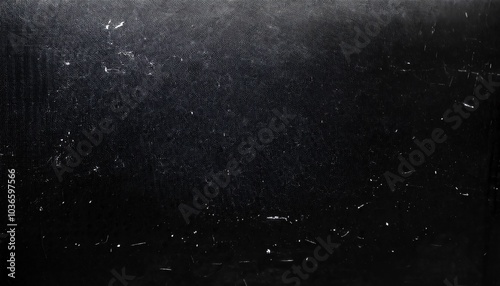 Black grunge scratched surface with white marks background texture