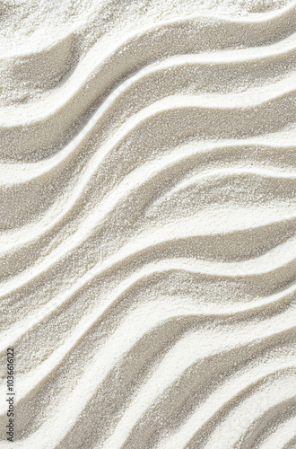 A texture of lines drawn in the sand on the beach