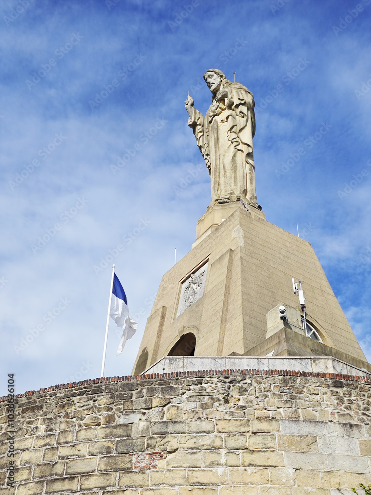 Naklejka premium A statue of Jesus Christ at the mountain Urgull. San Sebastian Donostia, the Basque country, Spain