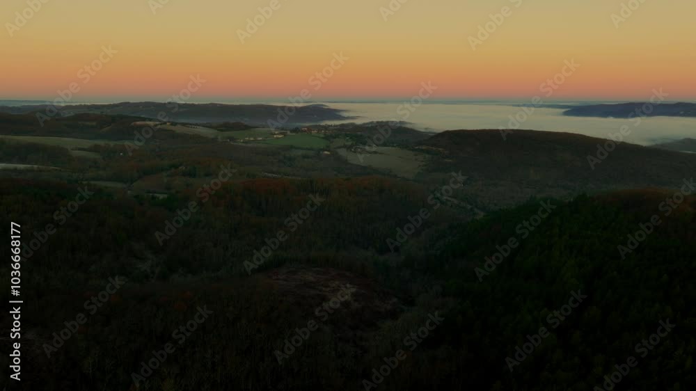sunset over the hills with mist
