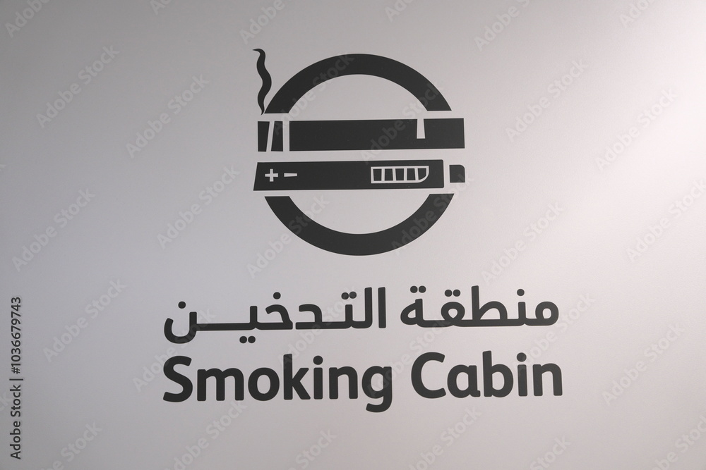 UAE - October 1, 2024: Sign or information board written in Arabic and English at an airport in Middle east UAE - October 1, 2024: Sign or information board written in Arabic and English at an airport in Middle east