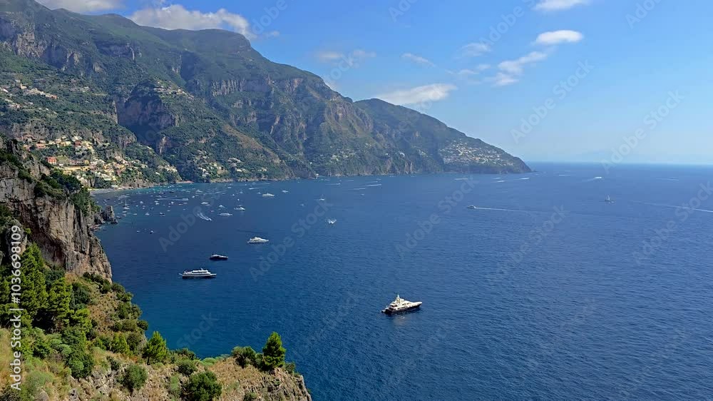 Explore the stunning Amalfi Coast Italy as boats glide across shimmering waters beneath a clear blue sky. Marvel at the majestic cliffs and vibrant island homes along the coastline. Explore the stunning Amalfi Coast Italy as boats glide across shimmering waters beneath a clear blue sky. Marvel at the majestic cliffs and vibrant island homes along the coastline.