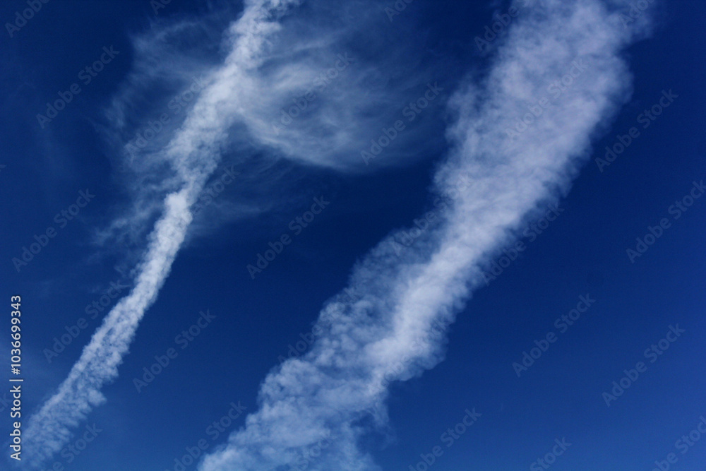Landscape of plane tracks on a blue sky on a sunny day Landscape of plane tracks on a blue sky on a sunny day