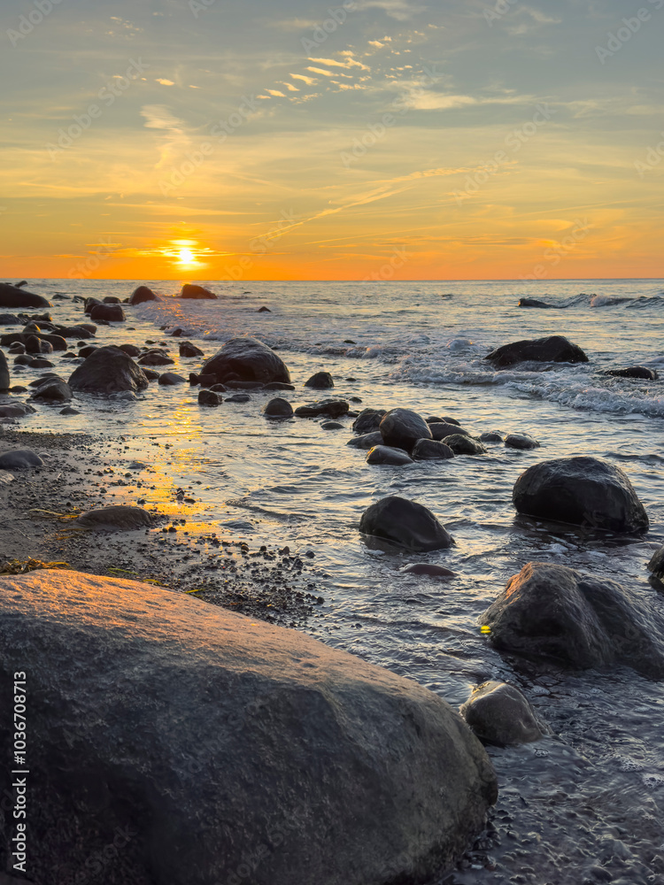 sunset on the beach with rocks on the baltic sea, isalnd Rügen in Germany Cap Arkona sunset on the beach with rocks on the baltic sea, isalnd Rügen in Germany Cap Arkona
