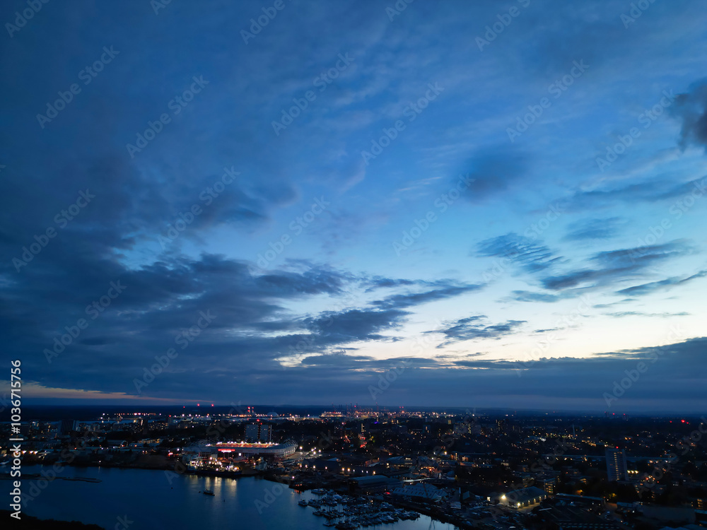 Naklejka premium Aerial View of Illuminated Southampton Docks and Port City Centre During Dark Night. England United Kingdom. High Angle Drone's Camera Footage Captured from High Altitude on May 5th, 2024