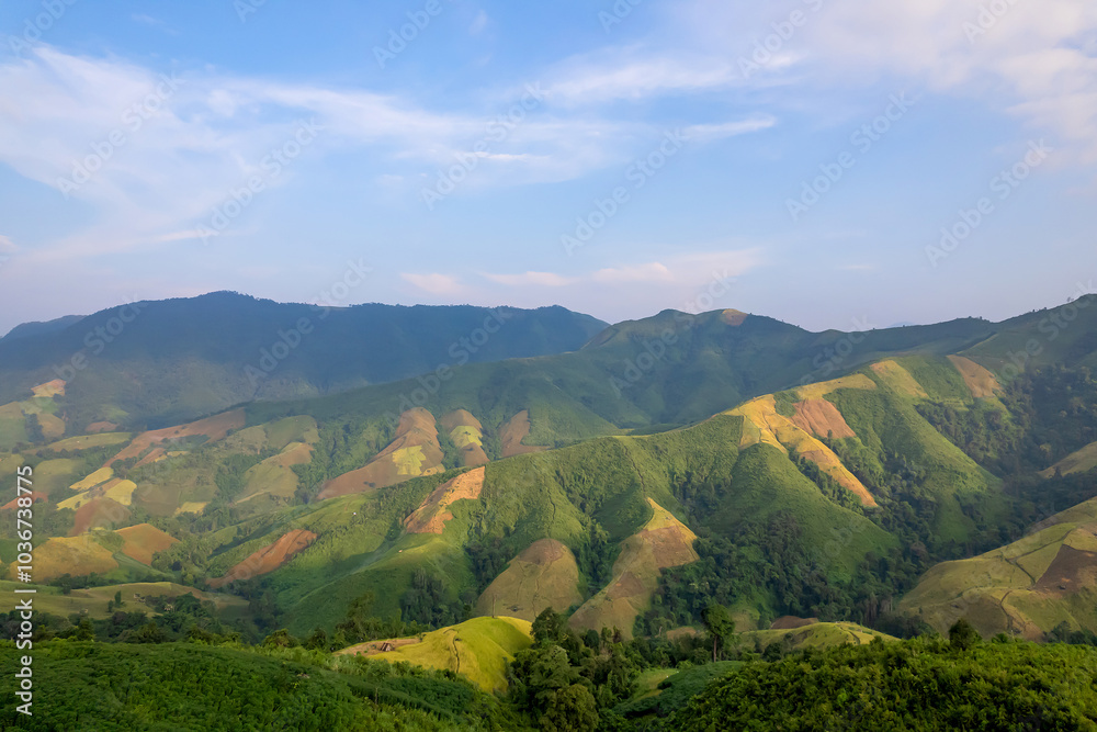 Naklejka premium Aerial view of amazing mountain landscape colorful sunset over the cloudy sky.