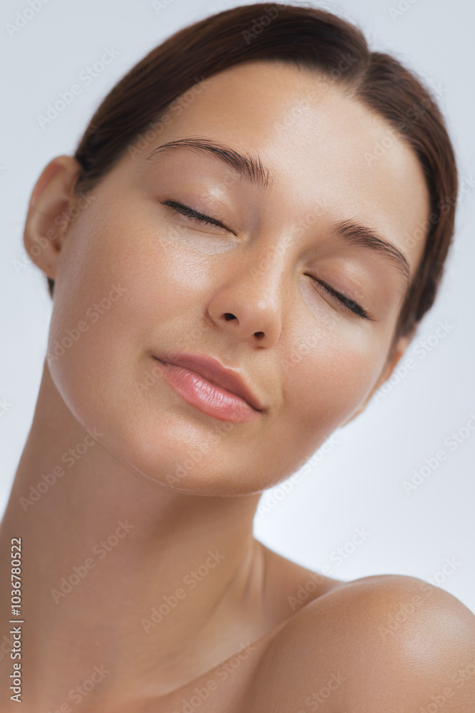 A serene woman with glowing skin and closed eyes, expressing relaxation and calm. Her flawless complexion makes this image ideal for beauty, skincare, and wellness campaigns promoting self-care and A serene woman with glowing skin and closed eyes, expressing relaxation and calm. Her flawless complexion makes this image ideal for beauty, skincare, and wellness campaigns promoting self-care and
