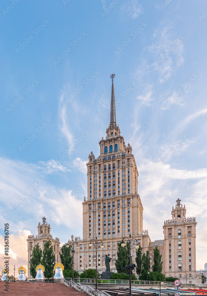 Fototapeta premium high-rise stalinist building near river at summer sunset in Moscow, Russia. Historic name is Hotel Ukraine.