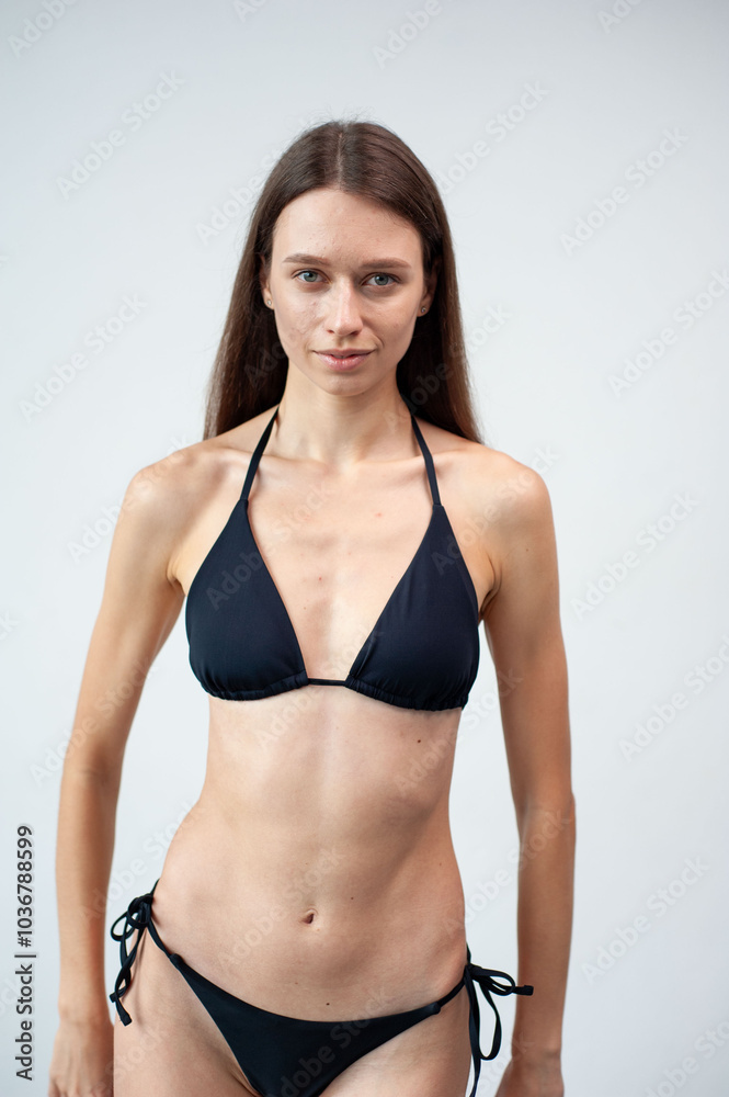 Summer, body and portrait of woman in studio with confidence for fashion and swimwear. Model girl, happiness and bikini for tropical holiday and relax with aesthetics and glow by white background Summer, body and portrait of woman in studio with confidence for fashion and swimwear. Model girl, happiness and bikini for tropical holiday and relax with aesthetics and glow by white background