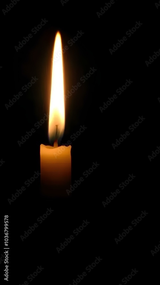 Burning candle on black background with space for text. For themes related to remembrance, mourning, loss or spirituality, hope and keeping the fire of life burning.