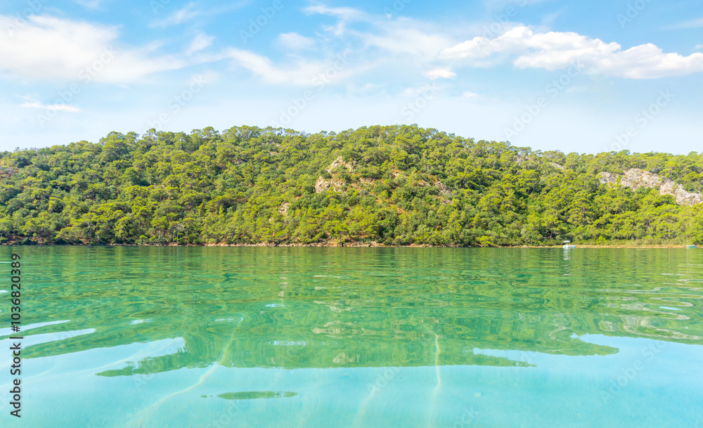 Calm Blue Lagoon on a Clear Summer Day – A Tropical Paradise for Relaxation Calm Blue Lagoon on a Clear Summer Day – A Tropical Paradise for Relaxation