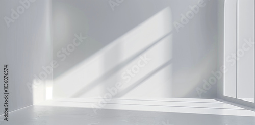 Photo of an abstract white background with a spotlight on the wall for product presentation