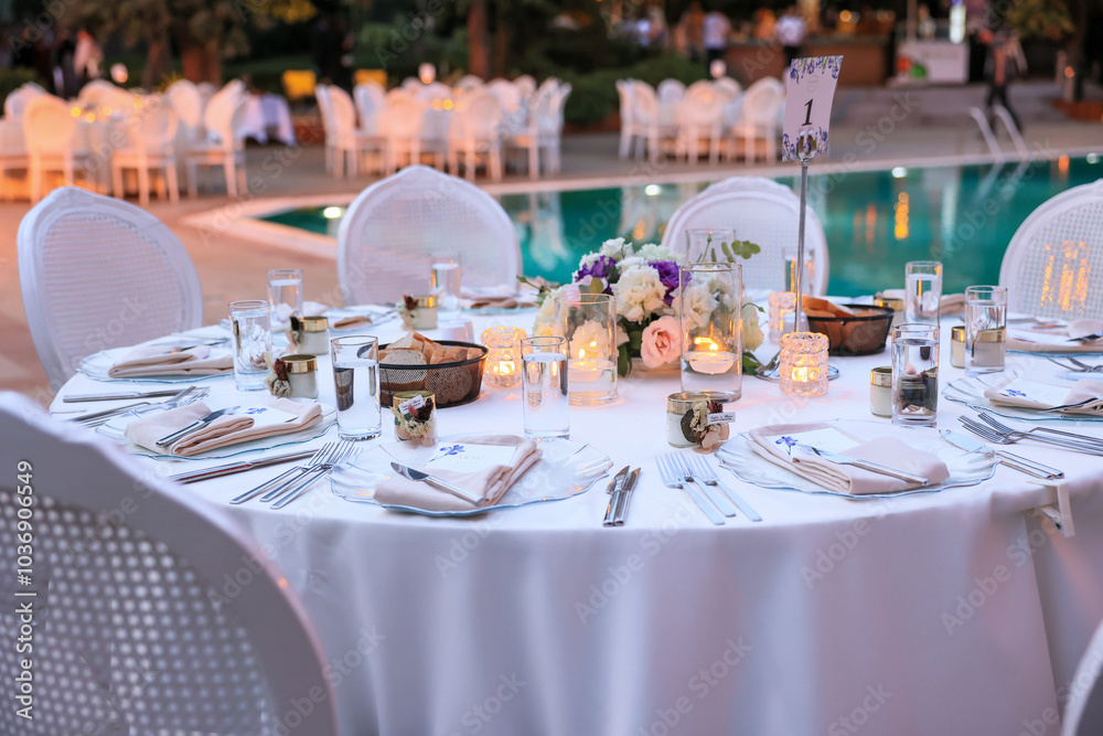 Luxury Wedding Venue: Beautifully Decorated Table with Candles and White Flowers