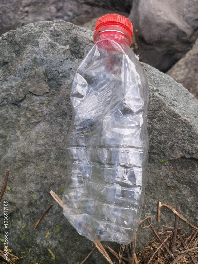 Obraz premium used bottles and plastic with a stone background