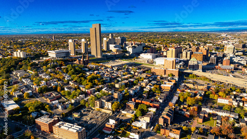 Albany cityscape with vibrant neighborhoods. This aerial view captures the vibrant neighborhoods and skyline of Albany, showcasing the blend of urban life and green spaces.