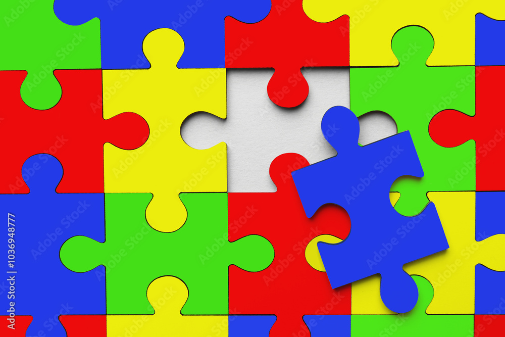 Many colorful puzzle pieces as background. Symbol of autism Many colorful puzzle pieces as background. Symbol of autism