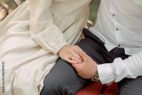 Bride and groom Newlyweds touch hands each other on wedding. A very subtle line trust. Relations between a man and a woman. The concept of love and romantic