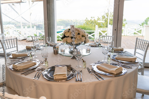 Obraz na płótnie Elegant Wedding Reception Table Setting with Floral Centerpieces Overlooking Scenic Lake View w salonie