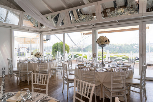 Elegant Wedding Reception Table Setting with Floral Centerpieces Overlooking Scenic Lake View