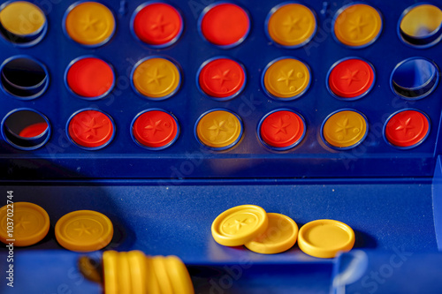Strategy game Four wins with yellow and red chips for two people.