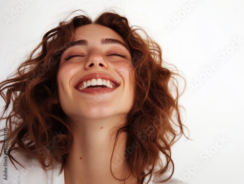 Happy cheerful laughing young woman isolated on light background, photo. 