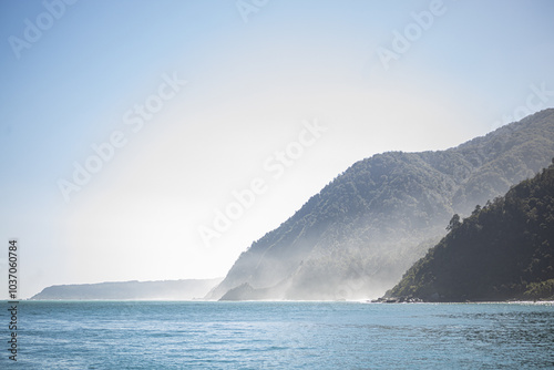 milford sound fjord with mountains and sun

