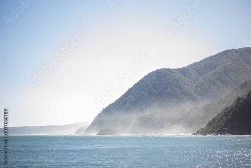 milford sound fjord with mountains and sun

