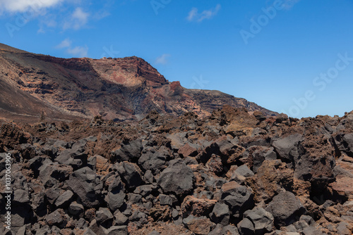 Hiking path crossing volcanic landscape leading