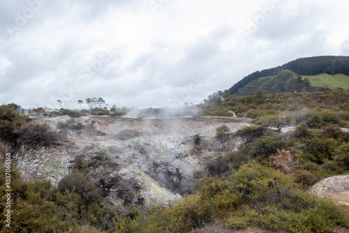 Geothermal activity creating steam in volcanic landscape