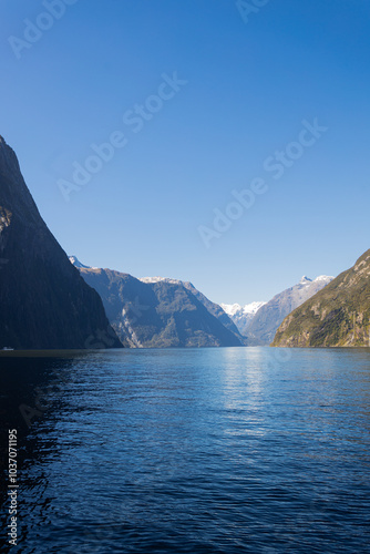 Milford sound fjord reflecting on sunny day with clear sky