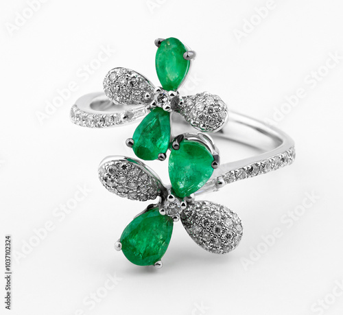 Gold ring with diamonds and emeralds. Diamond ring. White gold ring with emeralds and diamonds. Emeralds and diamonds. Fashion jewelry.