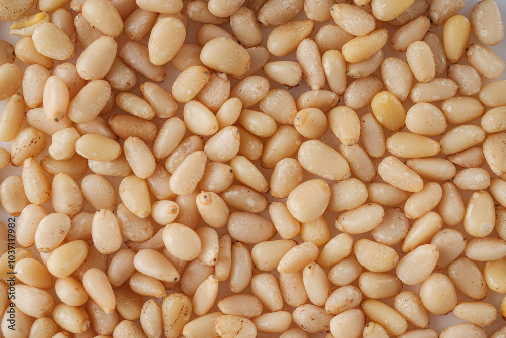 Shelled Pine Nuts: Close-Up of Roasted Siberian Seeds on a White Background Shelled Pine Nuts: Close-Up of Roasted Siberian Seeds on a White Background