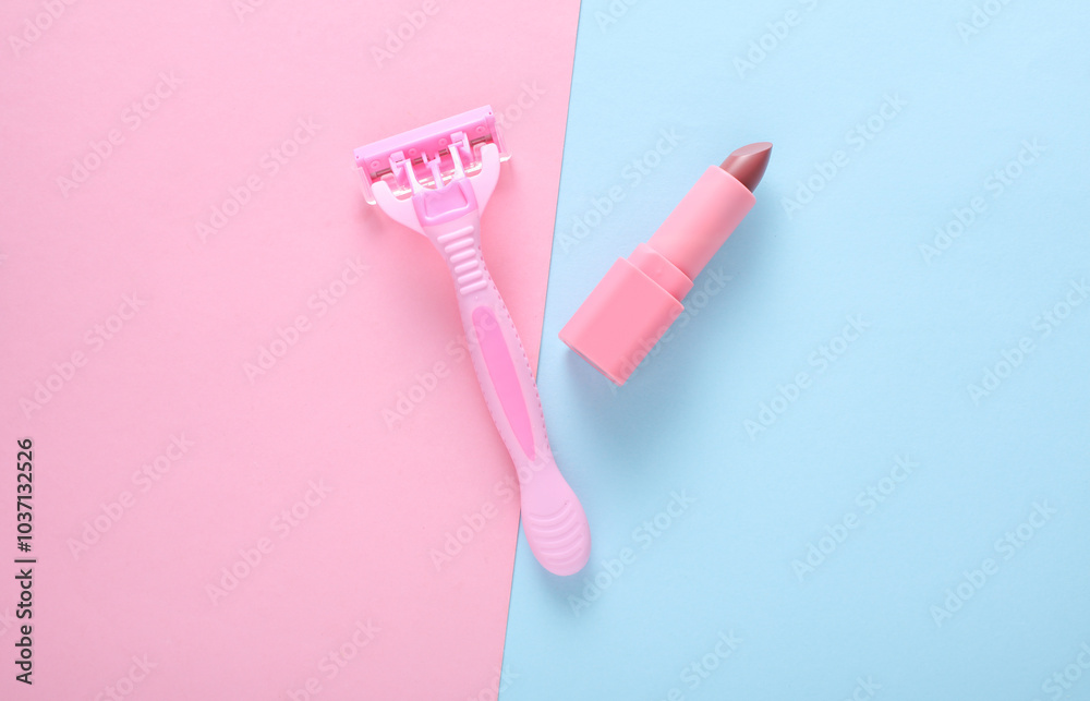 Razor with lipstick on blue pink background. Top view Razor with lipstick on blue pink background. Top view