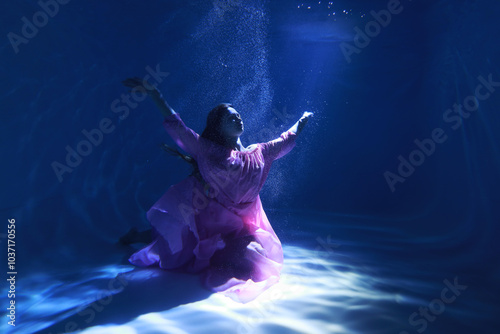 Wallpaper Mural Underwater portrait of young woman in dress in the light beam Torontodigital.ca