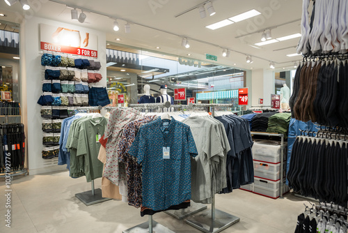 Elmina Lakeside Mall - Oct 23, 2024 :  Empty modern boutique filled with formal wear design, retail shop with fashionable clothes on hangers and racks photo