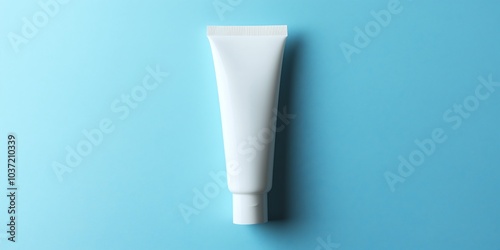 White tube of product against a blue background.