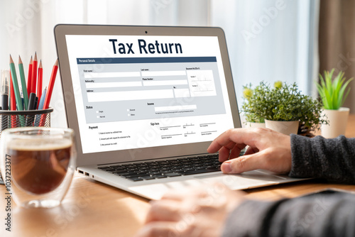 Online tax return form for submitting individual income tax return form snugly on the internet website. Government web for tax payment and return. Taxation technology concept. photo