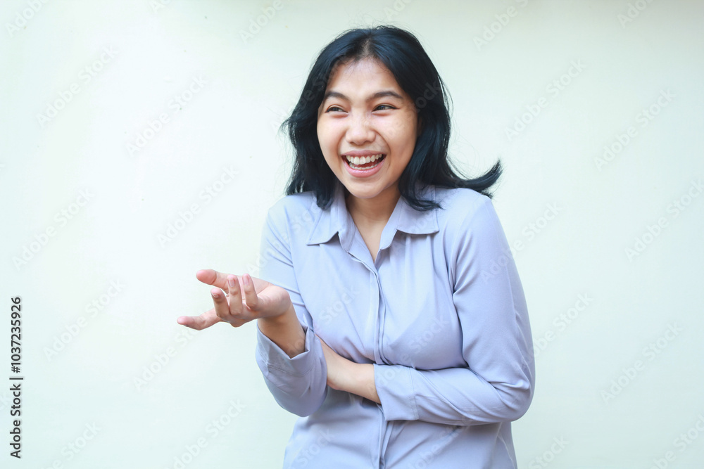 image of carefree asian business woman in formal office clothes laughing feeling pleased looking away raising open palm and folded arm presenting gesture standing over isolated white background image of carefree asian business woman in formal office clothes laughing feeling pleased looking away raising open palm and folded arm presenting gesture standing over isolated white background