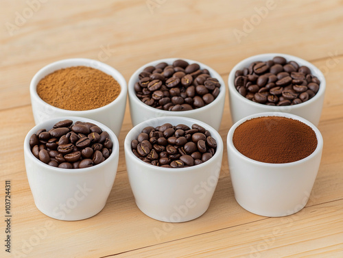 Variety of cups of coffee and coffee beans on old wooden table 