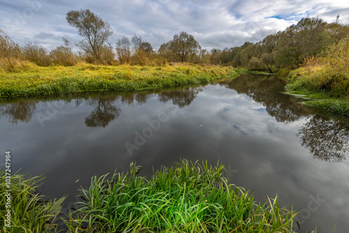 A calm river with trees on either side