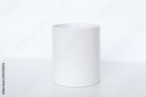 Elegant white ceramic mug isolated on a blank background, suitable for product marketing, mockups, and graphic design
