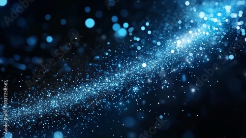 A mesmerizing collection of blue particles creating a sparkling, cosmic effect against a dark backdrop.