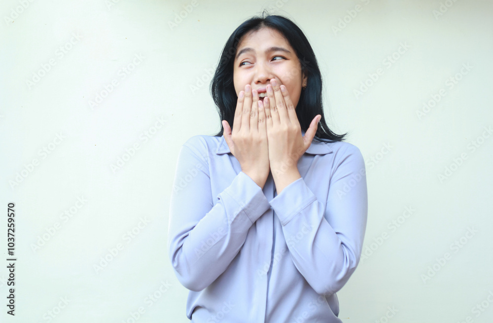 surprised asian young business woman covering her open mouth looking away to empty space wearing purple formal shirt standing over isolated white background surprised asian young business woman covering her open mouth looking away to empty space wearing purple formal shirt standing over isolated white background