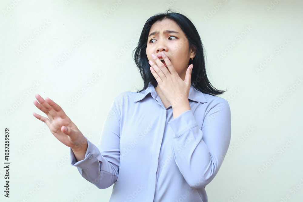 shocked beautiful asian young business woman looking away frightened with hands reaching out and covering her open mouth wearing formal office clothes standing over isolated white background shocked beautiful asian young business woman looking away frightened with hands reaching out and covering her open mouth wearing formal office clothes standing over isolated white background
