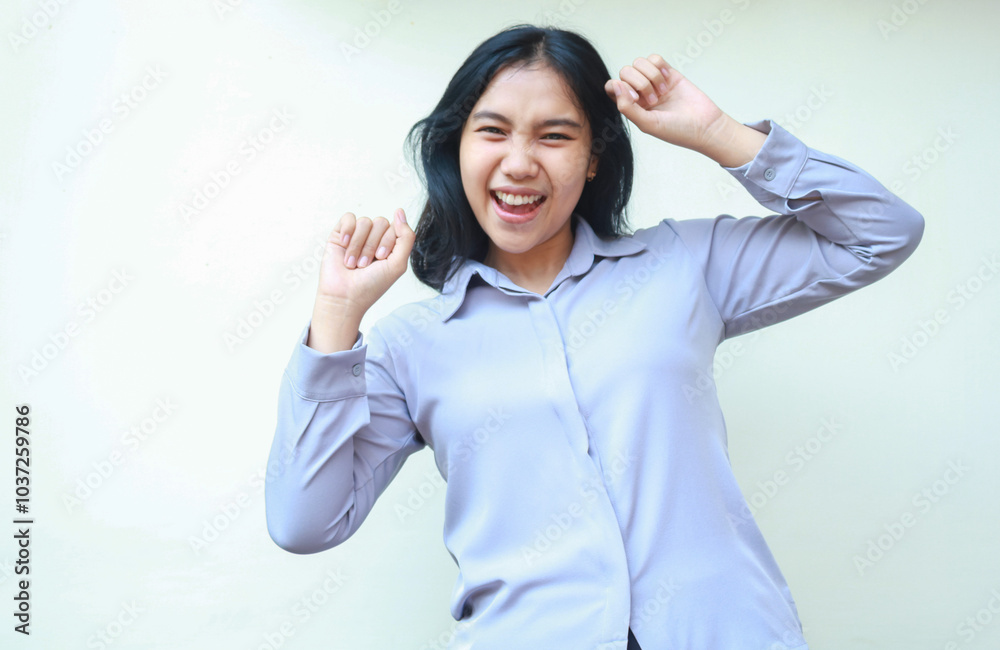 enthusiastic pretty asian young business woman raising fist pump say yes gesture look at camera, celebrating victory, winning and achievement with dance wear formal shirt isolated on white background enthusiastic pretty asian young business woman raising fist pump say yes gesture look at camera, celebrating victory, winning and achievement with dance wear formal shirt isolated on white background